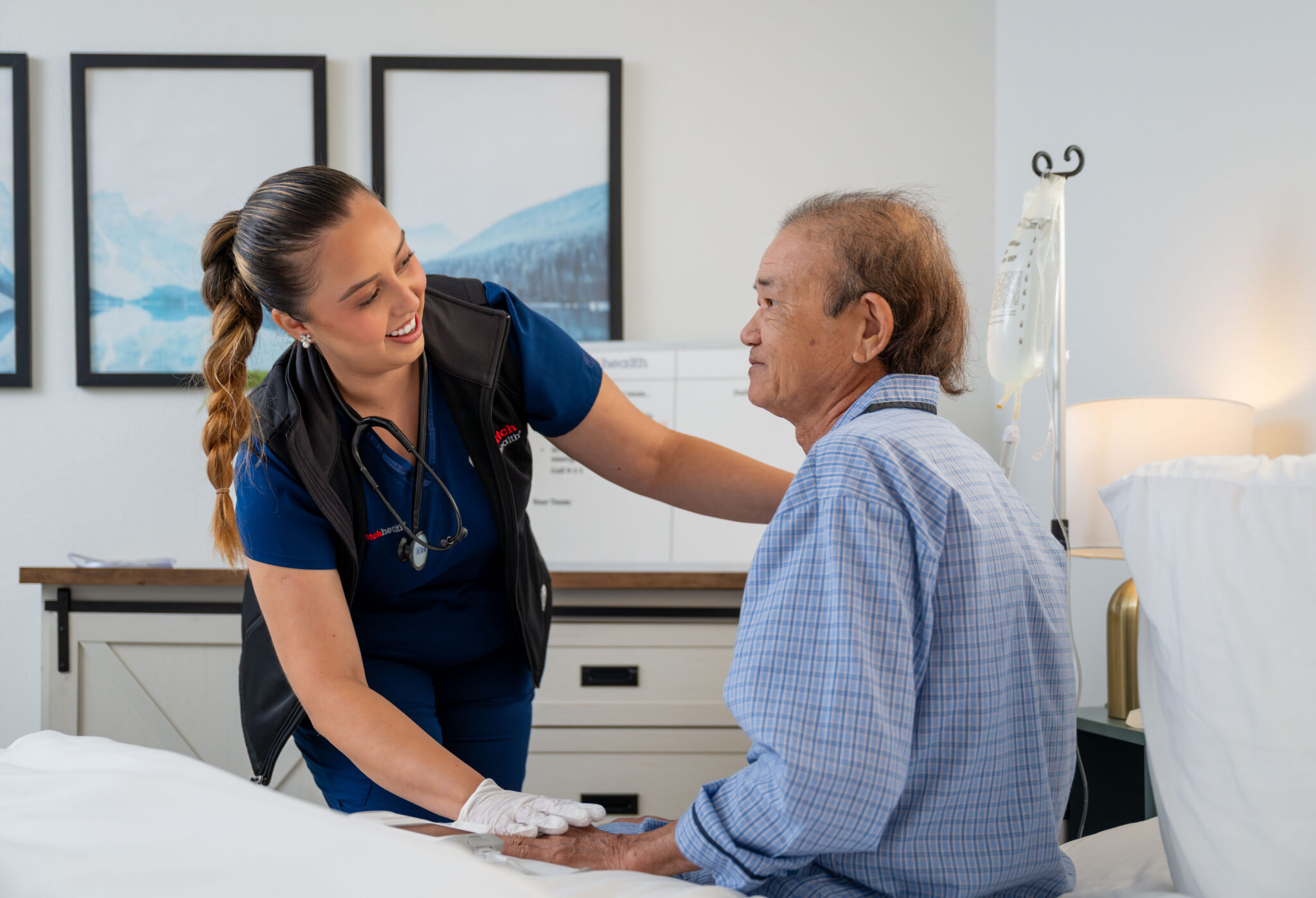 DispatchHealth medical team arriving at elderly patient's door with medical equipment for home healthcare visit