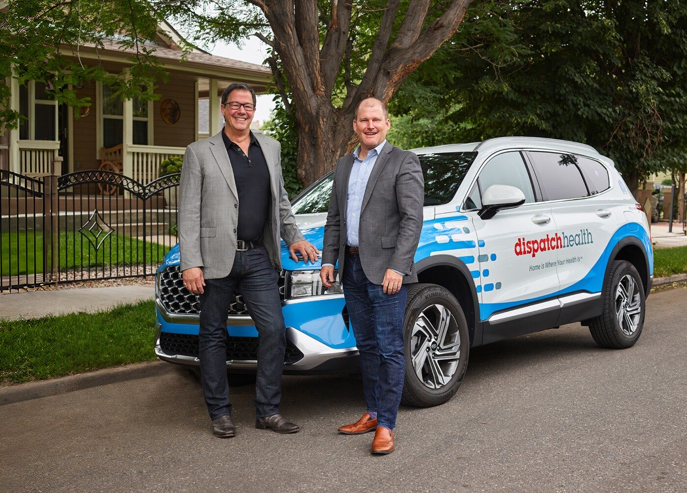 DispatchHealth founders Dr. Mark Prather and Kevin Riddleberger standing by company vehicle
