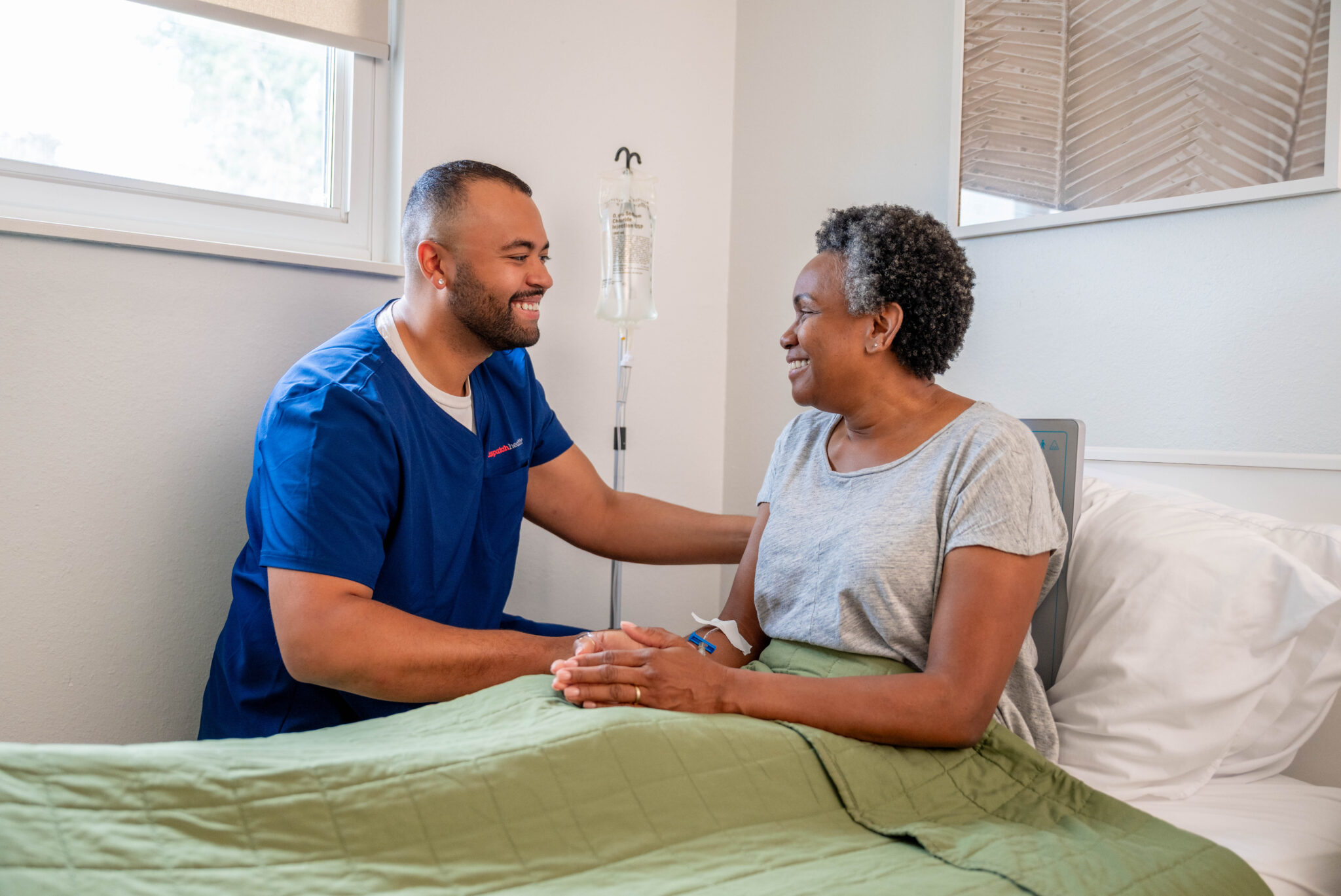 DispatchHealth nurse wearing stethoscope and protective mask