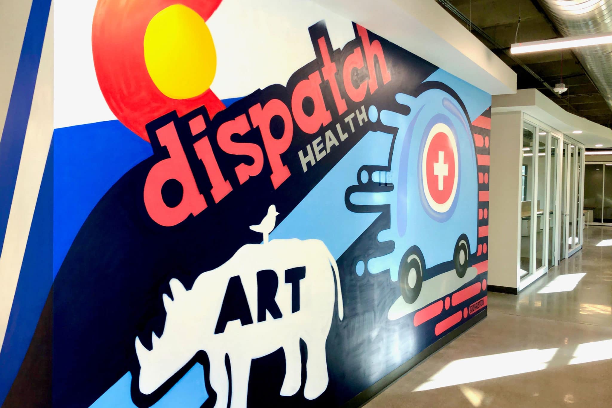 DispatchHealth office interior wall mural featuring Colorado flag, DispatchHealth branding, Art text with buffalo silhouette, and mobile medical van illustration