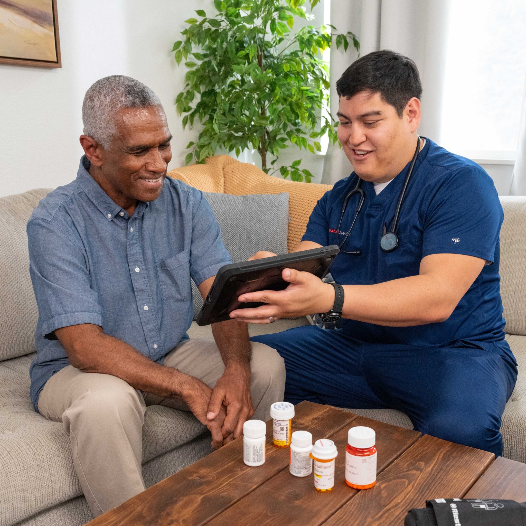 DispatchHealth medical professional smiling while providing compassionate in-home healthcare services